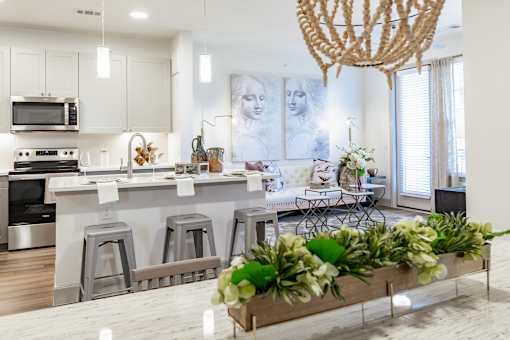 Kitchen with black appliances at Alys Crossing Apartments, Cypress