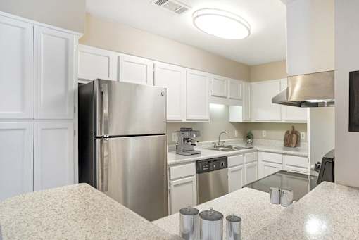 Kitchen with refrigerator at Arbors at Natchez Trace Apartments, Ridgeland, MS