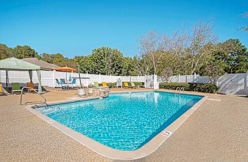 Swimming Pool with sitting area at Arbors at Natchez Trace Apartments, Ridgeland, MS