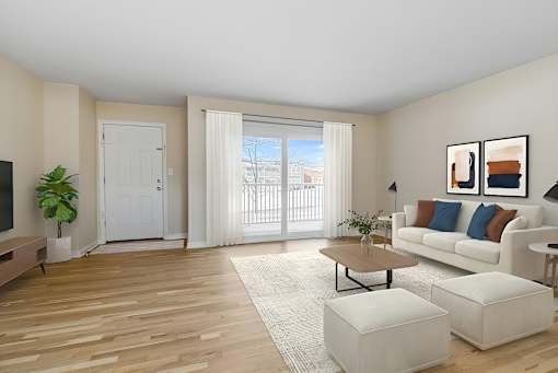 A living room with a white couch, a wooden floor, and a large window with white curtains. at Chatham Hill, New Jersey, 07928