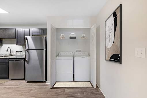 a washer and dryer in a laundry room with a refrigerator at Riverchase Landing, Alabama, 35244