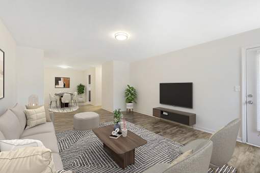a living room with a couch and a coffee table and a television at Riverchase Landing, Hoover, 35244