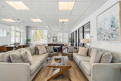 A spacious living room with a large couch and a coffee table. at Chatham Hill, New Jersey, 07928