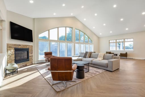 a living room with a couch and a chair and a fireplace at Copper and Quarry Village, Maryland, 21209