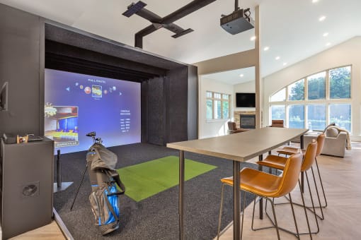 a conference room with a table and chairs and a projector screen at Copper and Quarry Village, Pikesville, 21209