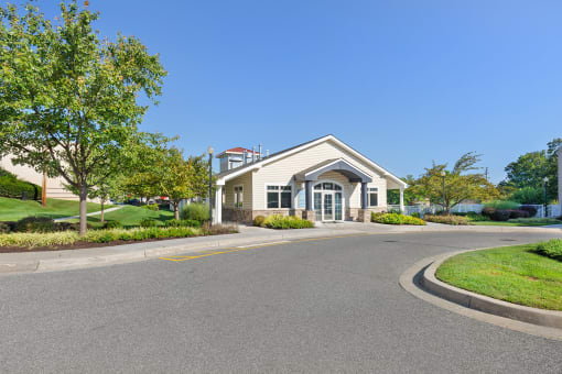 a building with a street in front of it and trees at Copper and Quarry Village, Maryland