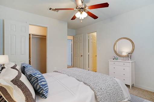 Bedroom with cozy bed at Crosswinds Apartments, Pearl, 39208