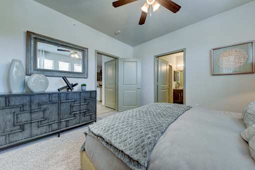 Bedroom with bed, lampsat Estraya Westover Hills, San Antonio at Estraya Westover Hills, San Antonio