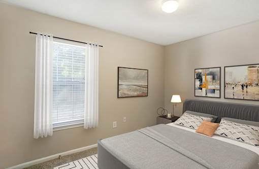 Bedroom with windows at Grand at Pearl Apartments, Pearl, Mississippi