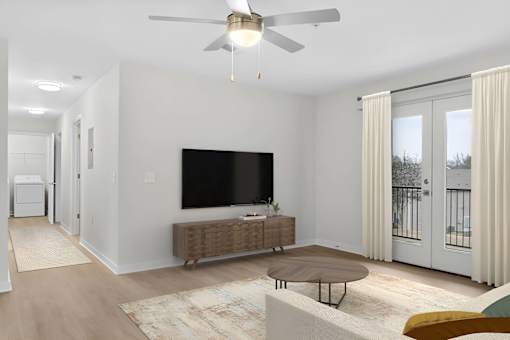 A modern living room with a flat screen TV and a brown sofa at Grand at Pearl Apartments, Mississippi, 39208