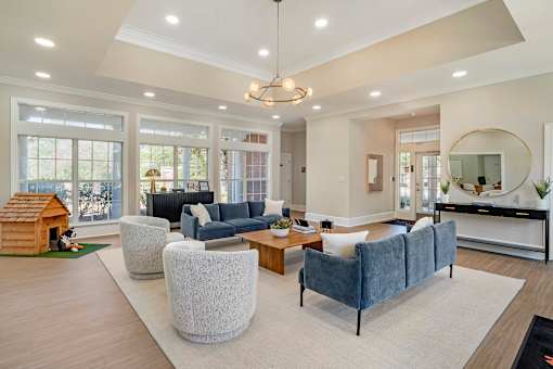 A spacious living room with a grey sofa and a wooden coffee table. at Greenbrier Estates, Slidell, 70460