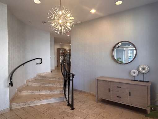 a view of the lobby of a house with stairs at Pier Village Apartments, New Jersey