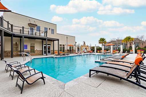 Pool with deck at La Veranda at Polly Lane Apartments, Louisiana
