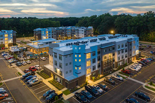 Exterior area at night at Lumen Apartments, Hampton, 23666