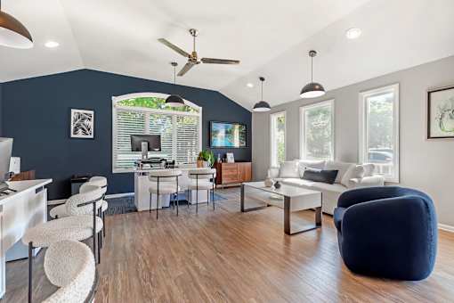 a living room with blue walls and a white couch and a table with chairs at Quail Ridge, Plainsboro Township, NJ, 08536