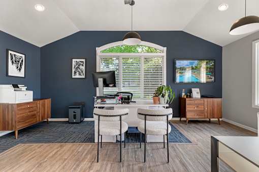 an office with blue walls and a window and a table with chairs at Quail Ridge, New Jersey, 08536