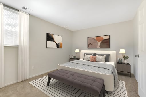a bedroom with a large bed and two windows at Copper and Quarry Village, Maryland