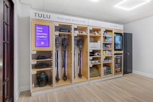 A Tulu store with a sign that says "Earn Free Monthly Credits!" is open for business.