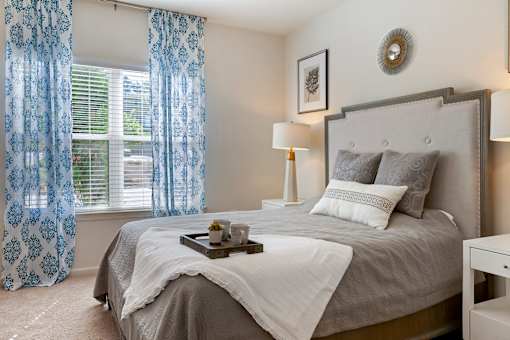 Bedroom with cozy bed at Skyland Exchange Apartments, Asheville, 28803