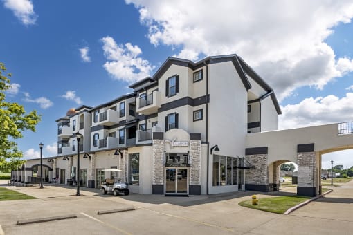 an apartment building with a golf cart parked in front of it