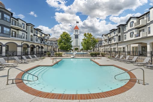 our apartments have a large pool with a church tower in the background