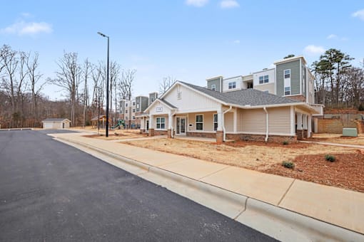 A residential area with a house and a street.