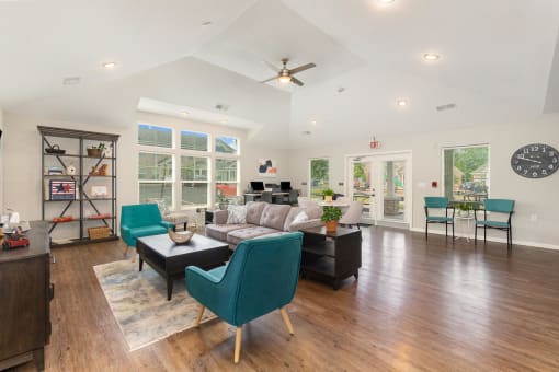a living room with a vaulted ceiling and hardwood floors