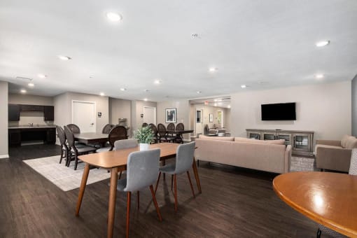 a dining room and living room with a table and chairs