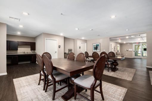 a large dining room with a large table and chairs