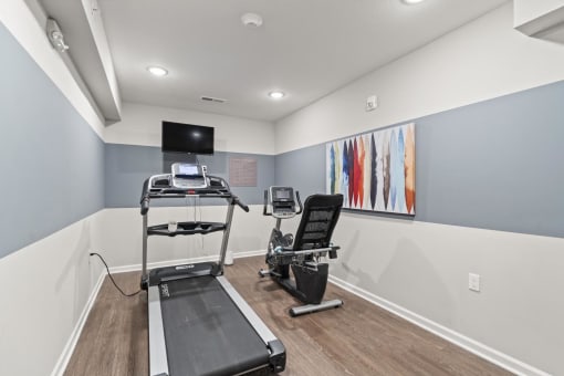 our apartments have a gym with equipment and a flat screen tv