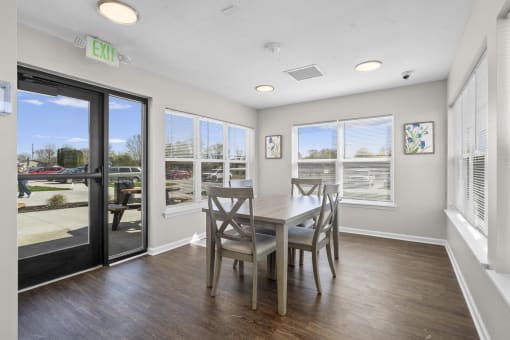 a dining room with a table and chairs