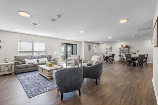 a living room with couches chairs and a coffee table