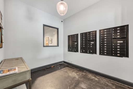 a room with mailboxes and a table