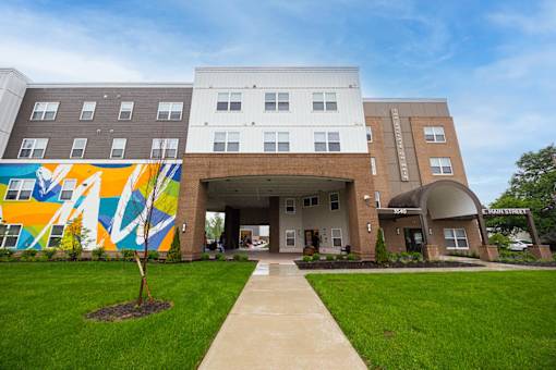 A building with a mural on the side of it.