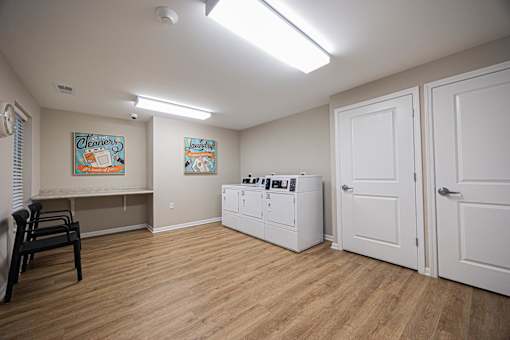 A room with a washer and dryer in it.