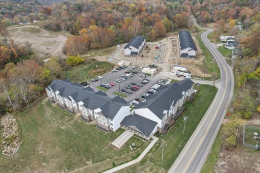 a view of a building from the air with a parking lot