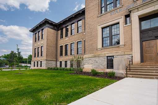 A large brick building with the words "Starling Ave" on the top.