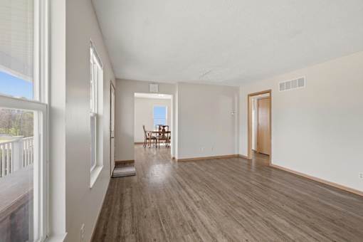 A room with wooden floors and white walls.