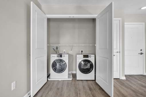 A laundry room with two washing machines.
