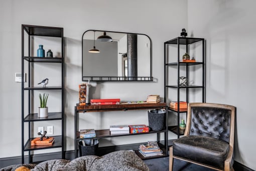 a bedroom with a bed and a mirror