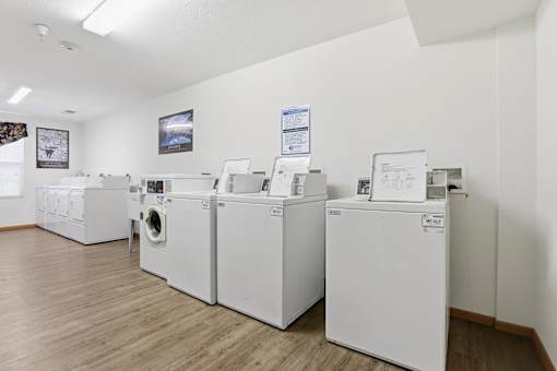 A row of washing machines in a laundromat.