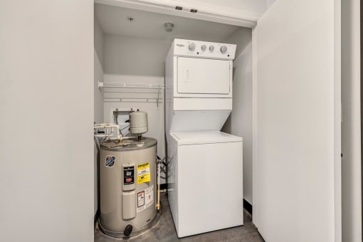 a small laundry room with a washer and dryer