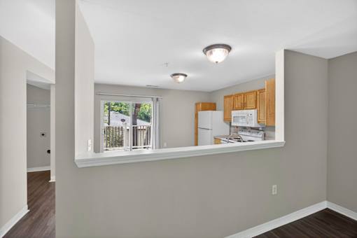 A kitchen area with a window and a countertop.
