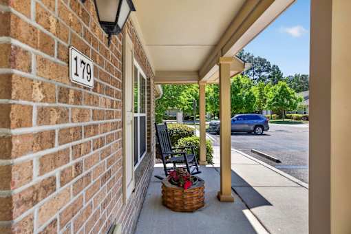 A brick building with a sign that says 179 on it.