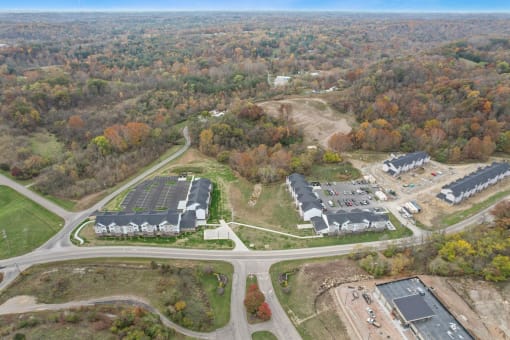 an aerial view of several buildings and a road