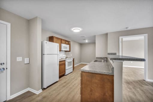a kitchen with a counter top and a refrigerator
