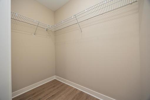 Empty room with a shelf on the wall.