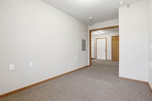 A long hallway with a door at the end.