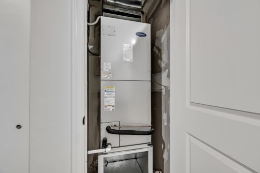 a white refrigerator freezer sitting next to a doorway