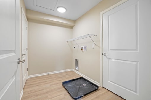a small bathroom with a shower and a door to a closet